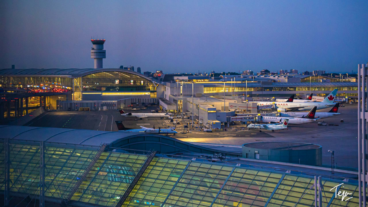 an airport with airplanes in the foreground
