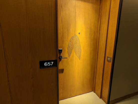a door with a leaf on it