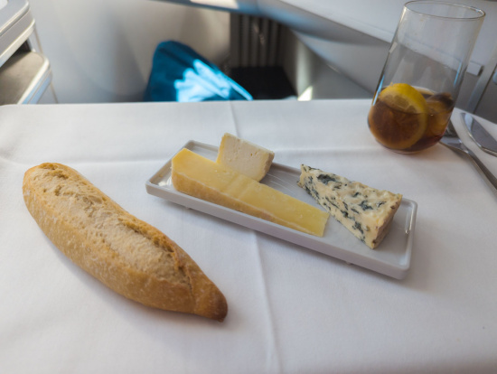 a plate of cheese and bread on a table