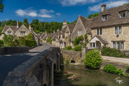 a stone houses with trees and Cotswolds