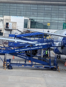 a blue airplane with a blue ladder