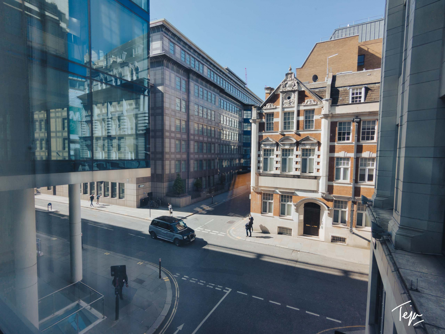 a street with cars and buildings