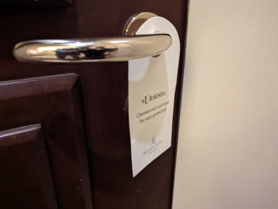 a door handle with a sign on it