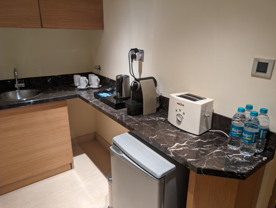 a kitchen counter with a toaster and coffee maker