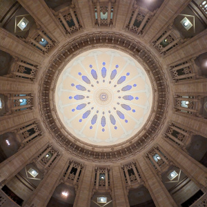 a circular ceiling with blue and white design
