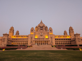 a large building with a lawn and a lawn