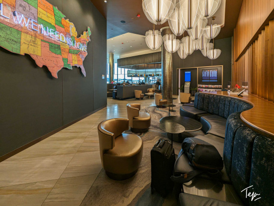 a lobby with a map of the united states and a couch