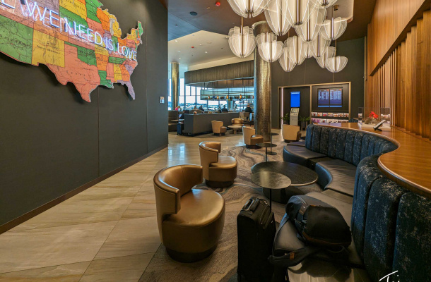 a lobby with a map of the united states and a couch