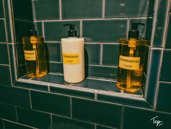 a group of soap dispensers on a shelf