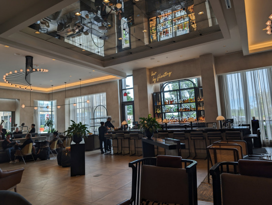 a room with a large bar and chairs