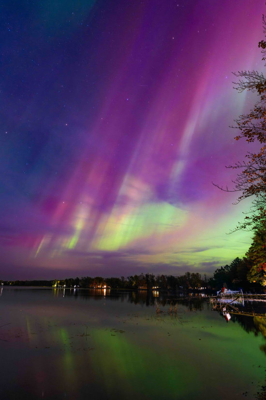 a colorful sky over a lake