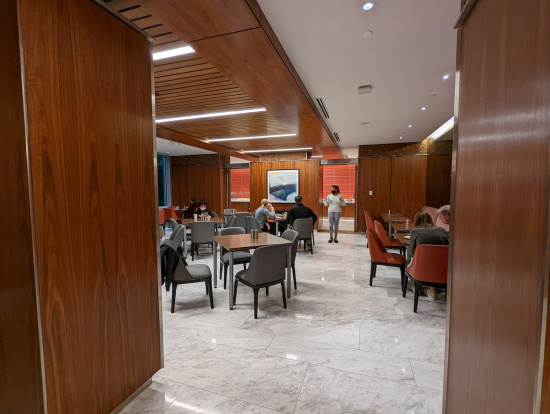 a group of people sitting at tables in a room