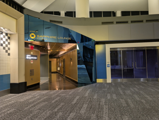 a lobby of a building with a glass door