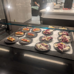 a display case with food on plates