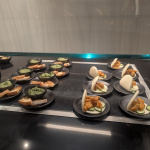 a group of plates of food on a table