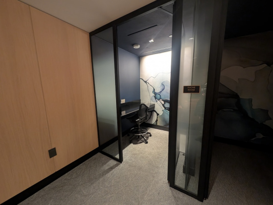 a room with glass walls and a chair