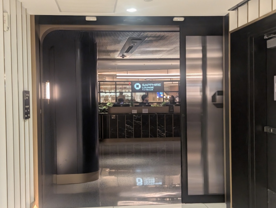 a lobby with a counter and a glass door