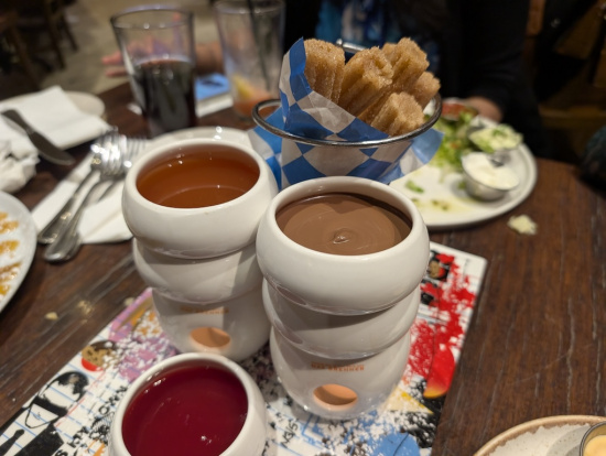 a group of white cups with brown liquid in them