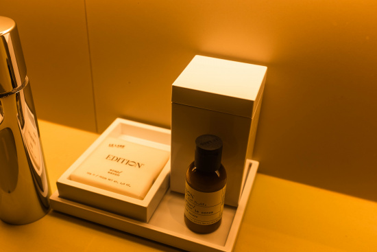 a small bottle and box on a tray