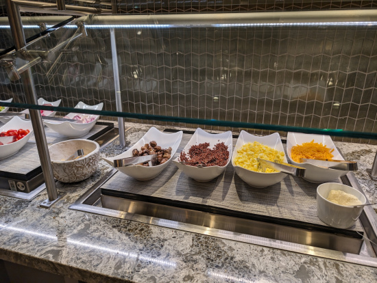 a row of bowls of food