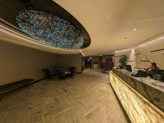 a lobby with a large ceiling and a counter