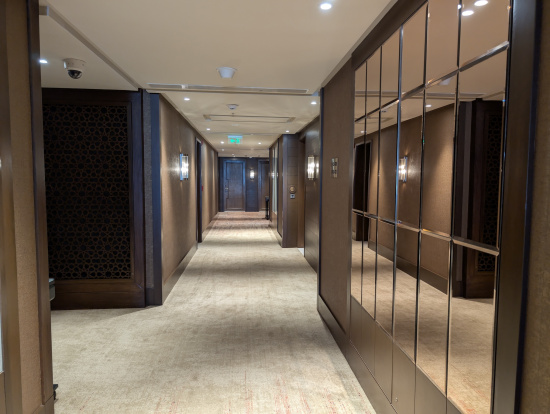 a hallway with mirrors and lights