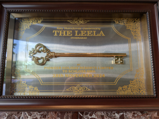 a gold key in a glass case