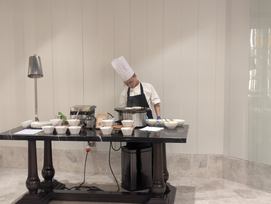 a man in a chef's hat cooking