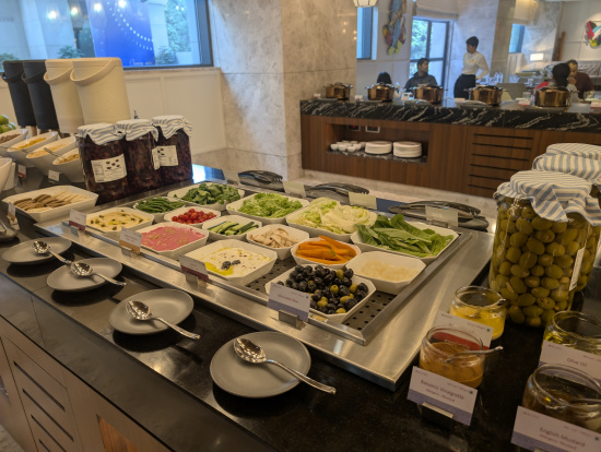 a buffet with different food items on it