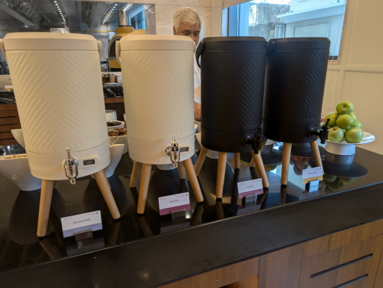 a group of white and black containers on a counter