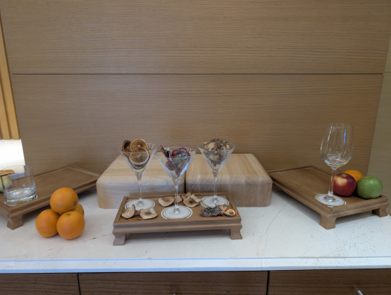 a tray with glasses and fruit on it