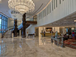 a large room with a chandelier and a staircase