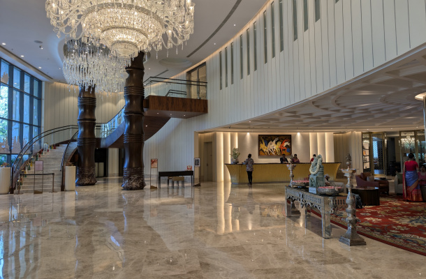 a large room with a chandelier and a staircase