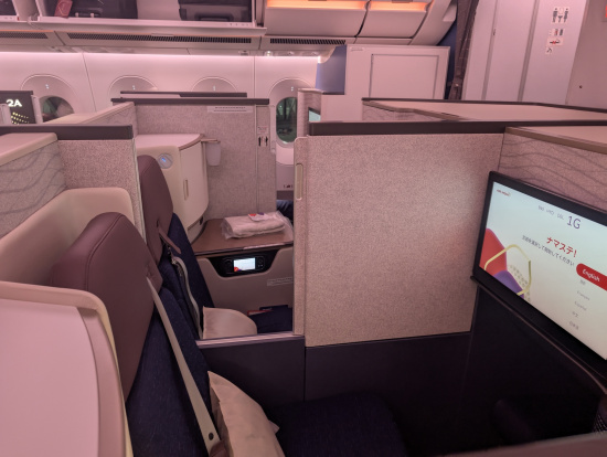 a tv and screen in an airplane