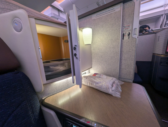 a table with a door open in the back of a plane