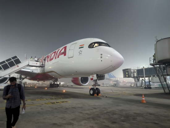 a white airplane with red writing on it