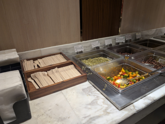 a buffet line with food in containers