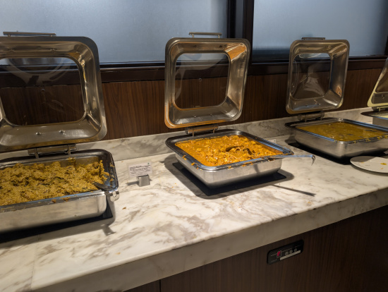 a group of food in containers on a counter