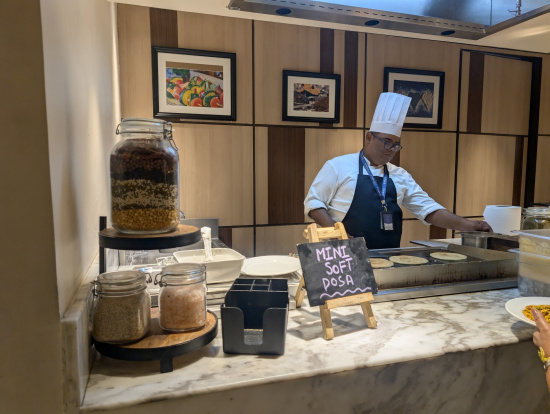 a man in a chef hat cooking food