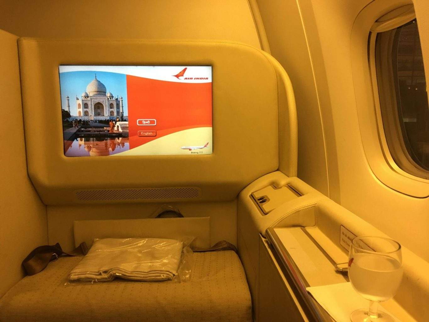 a screen on a seat in a plane