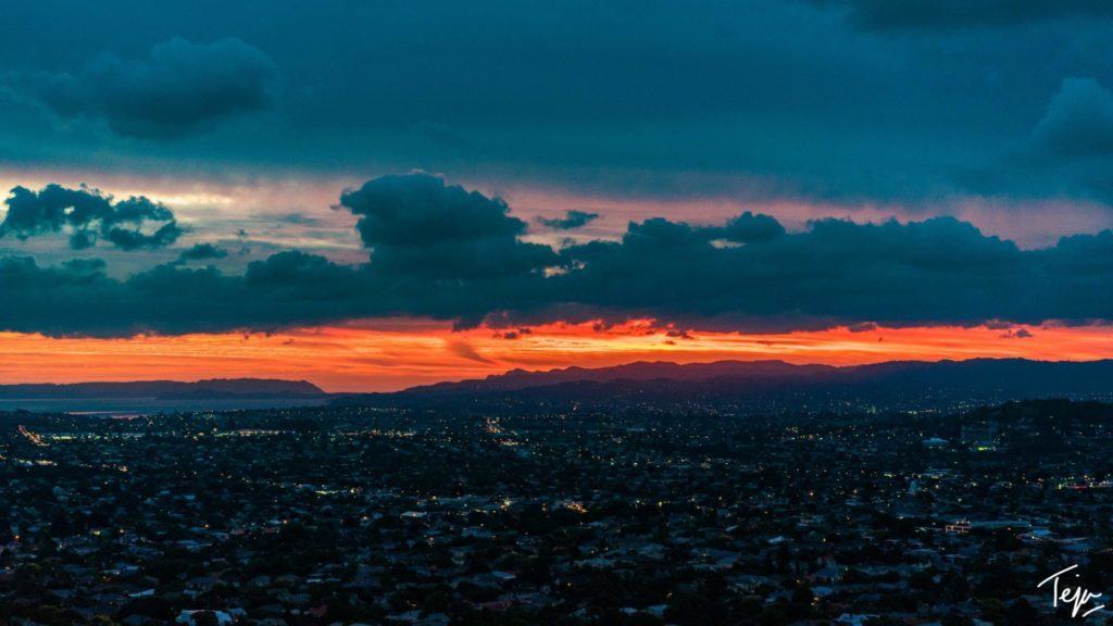 a sunset over a city